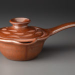 Very Small Sauce Pan With Neutrinos On Lid