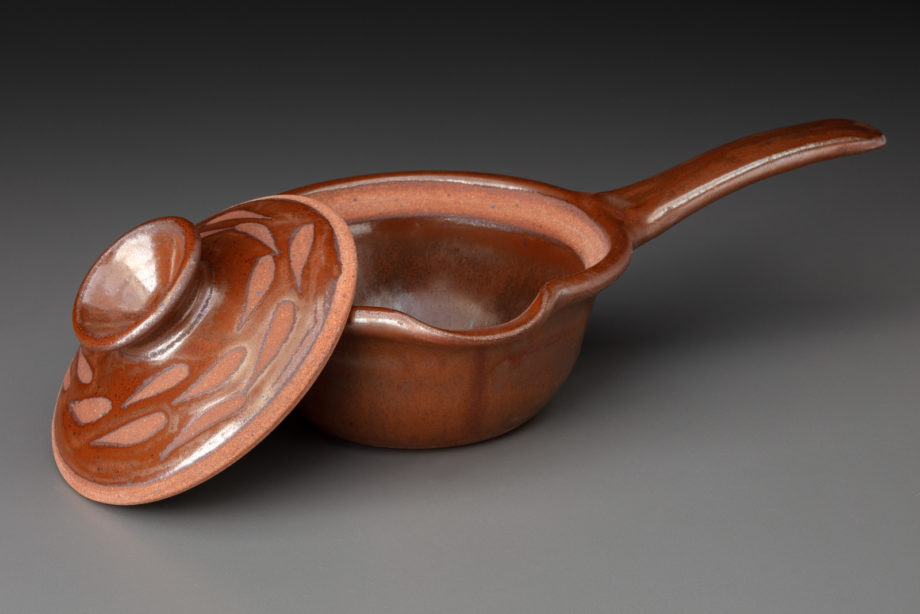 Very Small Sauce Pan With Neutrinos On Lid